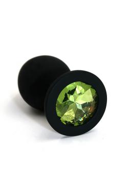 Анальная пробка Kanikule, силиконовая, чёрная со светло-зелёным кристаллом, М